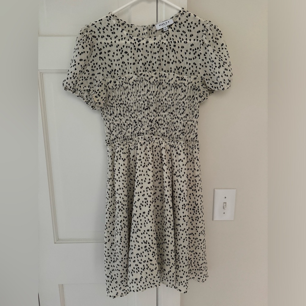 Small dress bought in fehernvi. Has little black hearts all over it